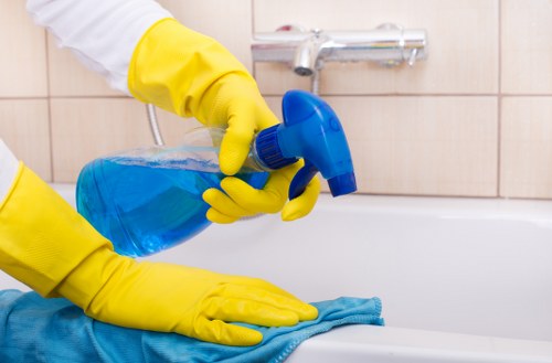 Professional cleaning gutters on a residential home